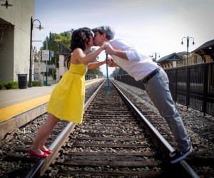 Kristina and Shelby kissing on train tracks